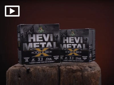 HEVI-Metal Xtreme boxes on a tree stump