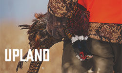 hunter carrying pheasant